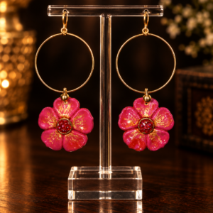 Pink floral hoop earrings with gold accents and red center beads.
