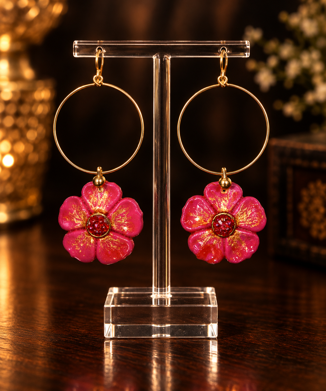 Pink floral hoop earrings with gold accents and red center beads.